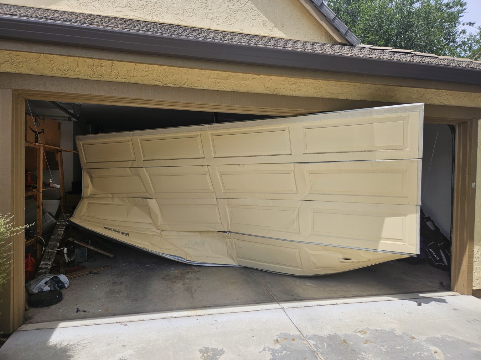 garage door bent and off track